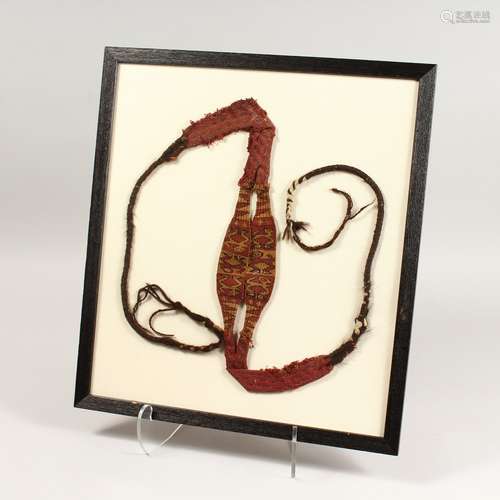 A CHIMU FABRIC SLINGSHOT in red and gold thread, framed and ...