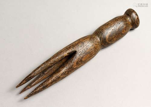 A CARVED WOOD TRIBAL FORK 7.5ins long