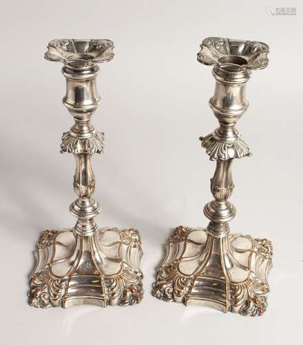 A PAIR OF PLAIN CANDLESTICKS 9ins high.