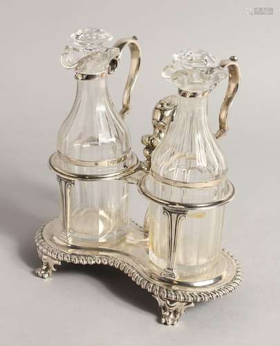 A GEORGE IV OIL AND VINEGAR CRUET with 2 glass bottles and s...