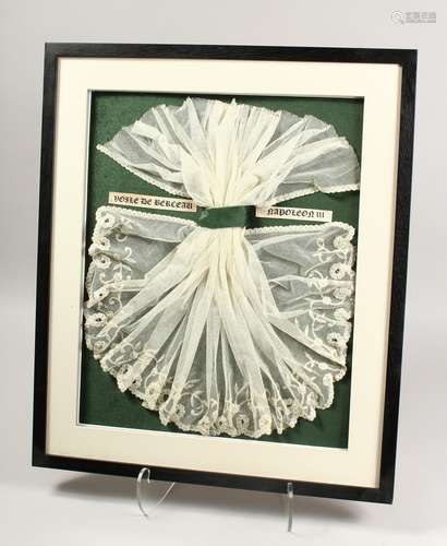 A SUPERB NAPOLEON III WHITE LACE FOR A COT, framed and glaze...