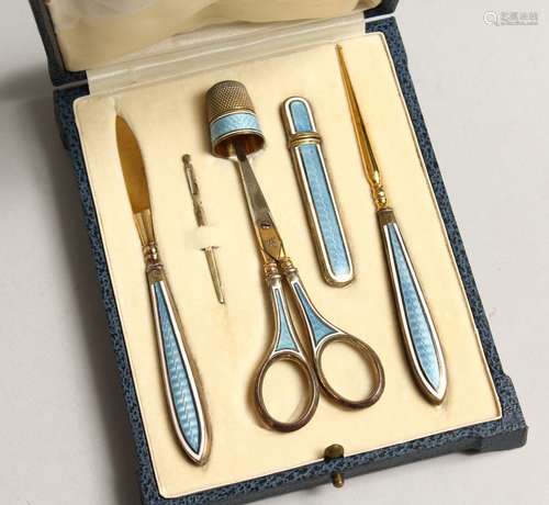 A SILVER AND ENAMEL TRAVELLING VANITY SET in a leather case ...