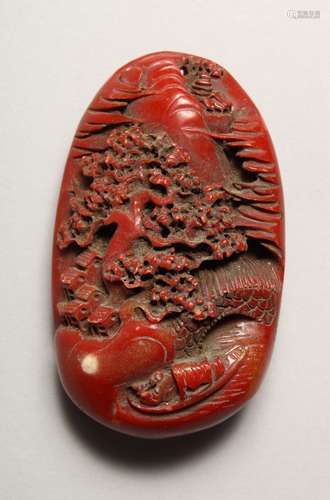 A CARVED CHINESE RED HARD STONE BOULDER. 3.5ins long