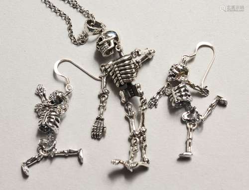 A PAIR OF SILVER ARTICULATED SKELETON EAR RINGS AND NECKLACE...