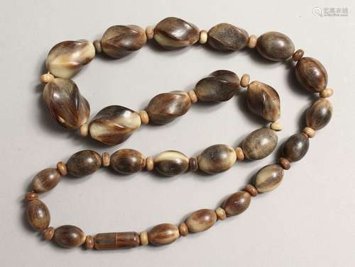 A STRING OF HORN BEADS