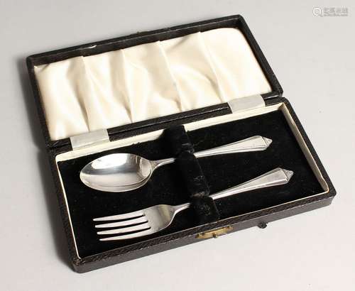 A CASED SILVER CHRISTENING SET,comprising of a spoon and for...