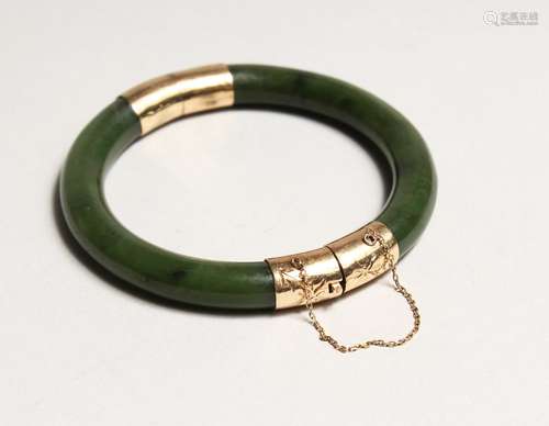 A GOOD MOUNTED JADE BANGLE