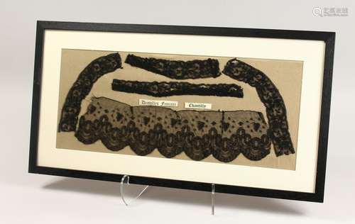 FIVE PIECES OF BLACK CHANTILLY LACE, framed and glazed. 9.5i...