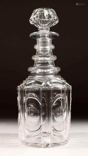 A HEXAGONAL CUT GLASS DECANTER AND STOPPER.