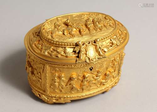 A FRENCH OVAL GILDED METAL JEWEL BOX AND COVER, the lid with...