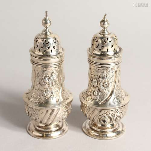 A PAIR OF ROCOCCO STYLE SILVER BALLISTER SHAPE PEPPERETTE, w...