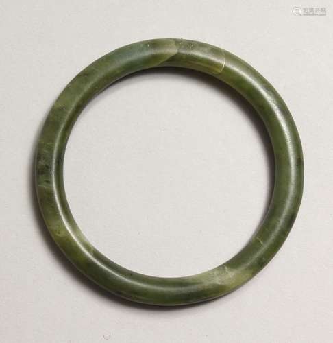 A GREEN JADE BANGLE