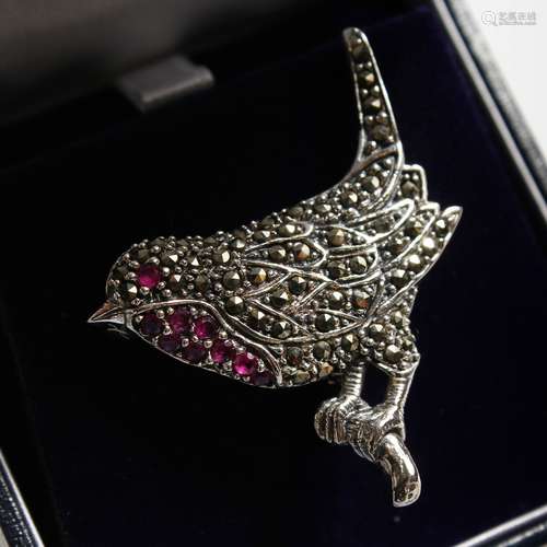 A SILVER MARCASITE AND RUBY ROBIN BROOCH