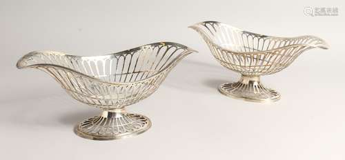 A PAIR OF SILVER OVAL PEDESTAL BASKETS, of openwork design, ...