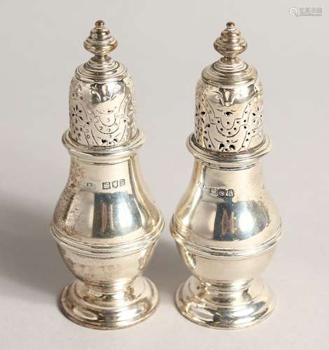 A PAIR OF PLAIN SILVER BALLISTER SHAPED PEPPERETTES. London,...