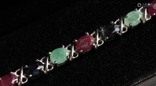 A SILVER RUBY, SAPPHIRE AND EMERALD LINE BRACELET