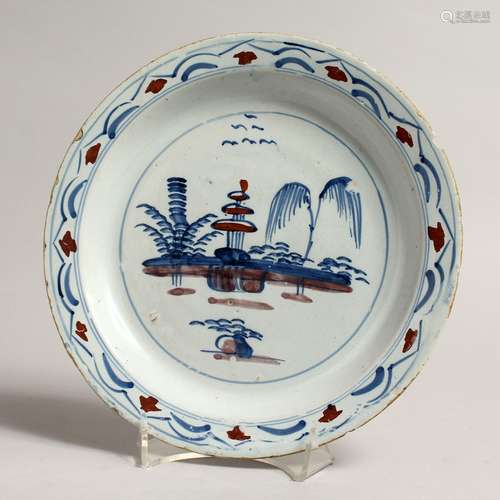 AN 18TH CENTURY ENGLISH BLUE AND WHITE TIN GLAZED CIRCULAR P...