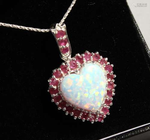 A SILVER RUBY AND OPAL HEART PENDANT on chain