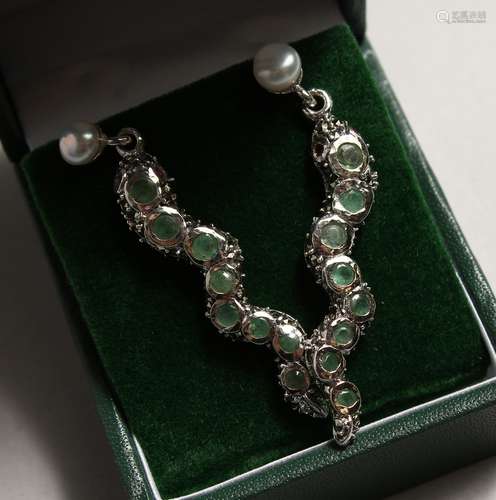 A PAIR OF SILVERR EMERALD SNAKE EAR RINGS