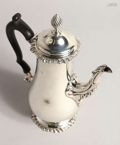 A SILVER COFFEE POT, with reeded finial, gadrooned rim and f...