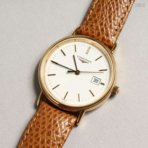 A LONGINES WRIST WATCH and leather strap.