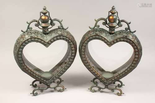 A PAIR OF HEART SHAPED GREEN PATENATED AND COPPER COLOURED H...