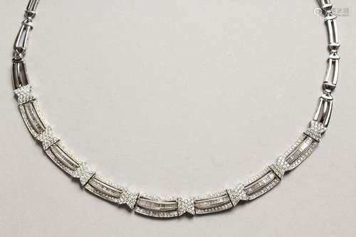 AN 18CT WHITE GOLD AND DIAMOND TRIPLE ROW NECKLACE in foldin...