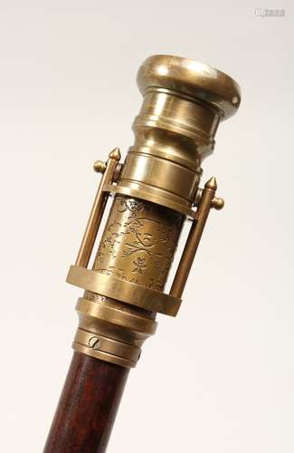 A NOVELTY WALKING STICK, the handle as a telescope and compa...