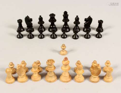 A TRAVELLING CHESS SET in a mahogany case.