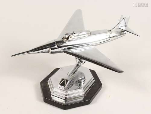 A CHROME AEROPLANE LIGHTER on stand