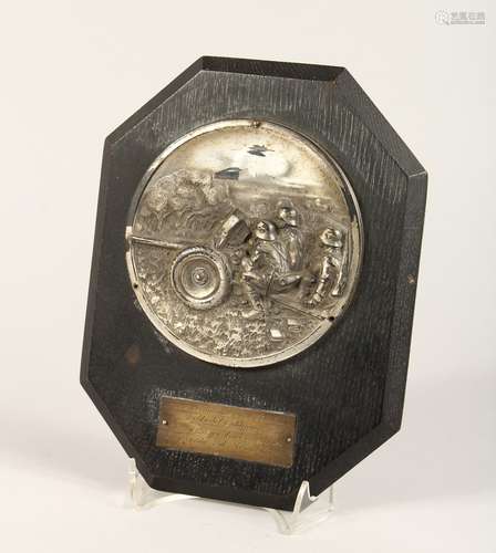 A GERMAN PRESENTATION PLAQUE with a plated cast metal rounde...