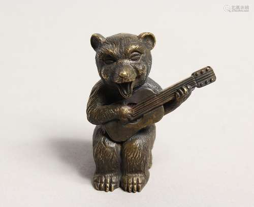 A NOVELTY BRASS BEAR PLAYING A GUITAR VESTA