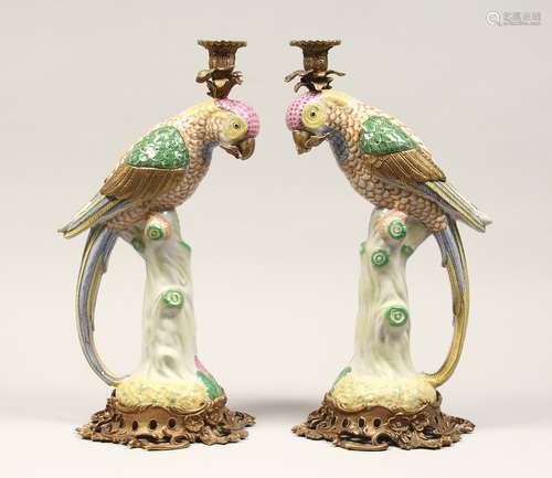 A PAIR OF DECORATIVE PORCELAIN AND ORMOLU CANDLESTICKS, mode...