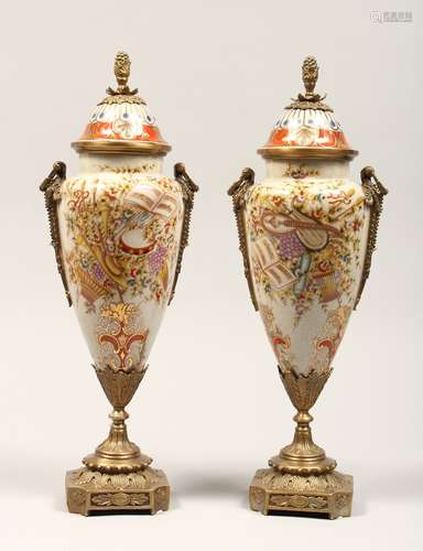 A PAIR OF PORCELAIN AND ORMOLU MOUNTED VASES AND COVERS, in ...