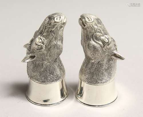 A PAIR OF .800 SILVER PLATED HORSE'S HEAD SALT AND PEPPERS