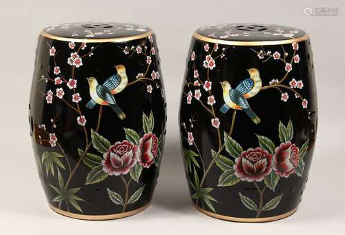 A PAIR OF CHINESE PORCELAIN BARREL SEATS, black ground decor...