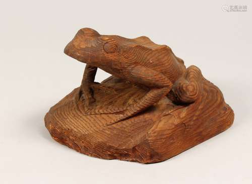 A CARVED WOOD FROG 7ins.