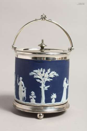 A WEDGWOOD JASPER WARE BLUE AND WHITE BISCUIT BARREL AND COV...