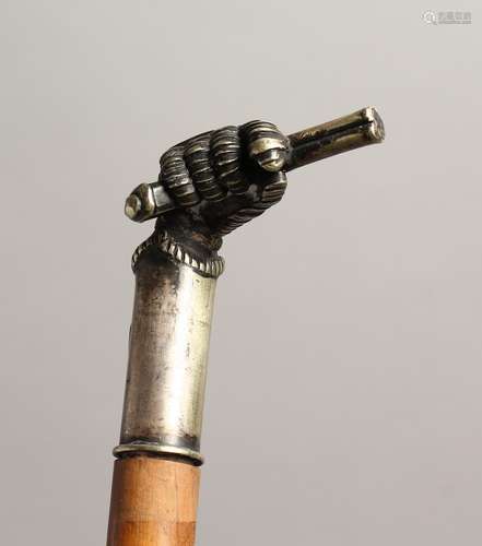 A 19TH CENTURY CANE with plated handles as a clenched fist h...