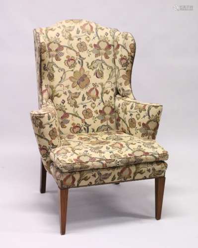 A GEORGIAN STYLE MAHOGANY WING ARM CHAIR with loose cushions...