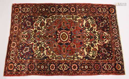 A PERSIAN BAKHTIAR CARPET, cream ground with all over floral...