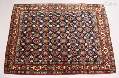 A GOOD PERSIAN WERAMIN SMALL CARPET, with rich blue ground w...