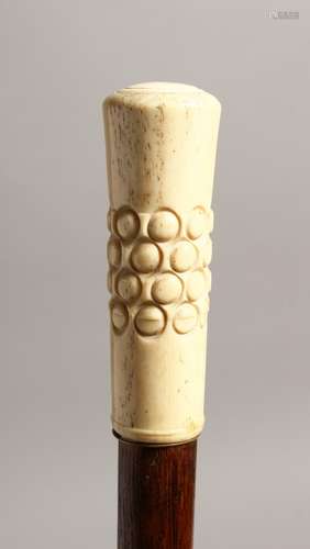 A 19TH CENTURY WALKING CANE with engraved ivory handle 37ins...