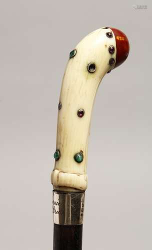 AN EDWARDIAN IVORY HANDLE WALKING CANE with silver band and ...