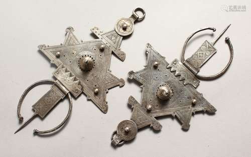 A SMALLER PAIR OF ISLAMIC SILVER HEAD PIECES