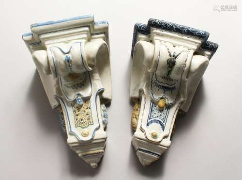 A PAIR OF MAJOLICA BRACKETS with painted decoration. 9ins lo...