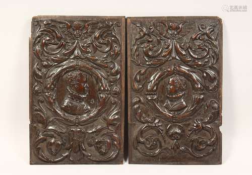 A GOOD PAIR OF ROMAN CARVED WOOD PANELS 19ins x 12ins.