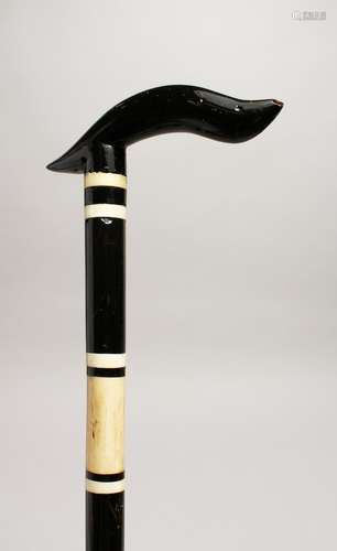 A BLACK AND WHITE WALKING STICK 36ins long