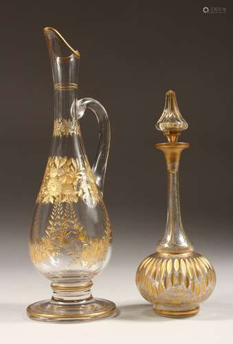 A GOOD GILDED SLENDER JUG engraved in gilt with flowers, 7in...