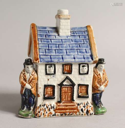 A 19TH CENTURY PRATTWARE MODEL OF A COTTAGE, with a male fig...